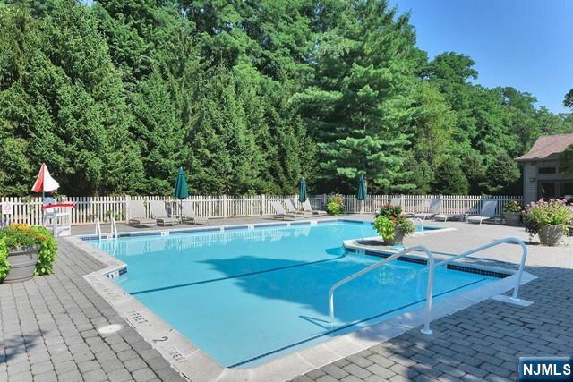 201 Beech Court Norwood, NJ 07648 - Photo 10 of 12 a view of a swimming pool with a patio