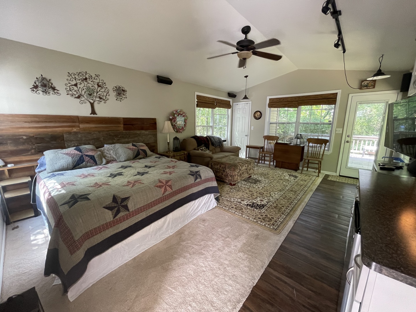 27-58 Woodhaven Lakes Sublette, IL 61367 - Photo 3 of 12 a bedroom with a bed a couch and a chandelier