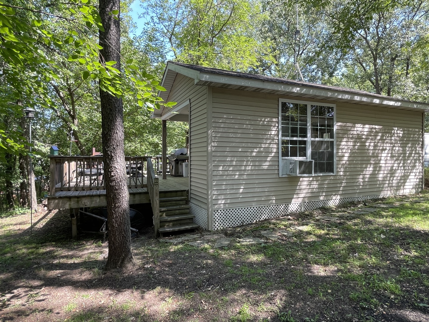 27-58 Woodhaven Lakes Sublette, IL 61367 - Photo 10 of 12 a backyard of a house with barbeque oven