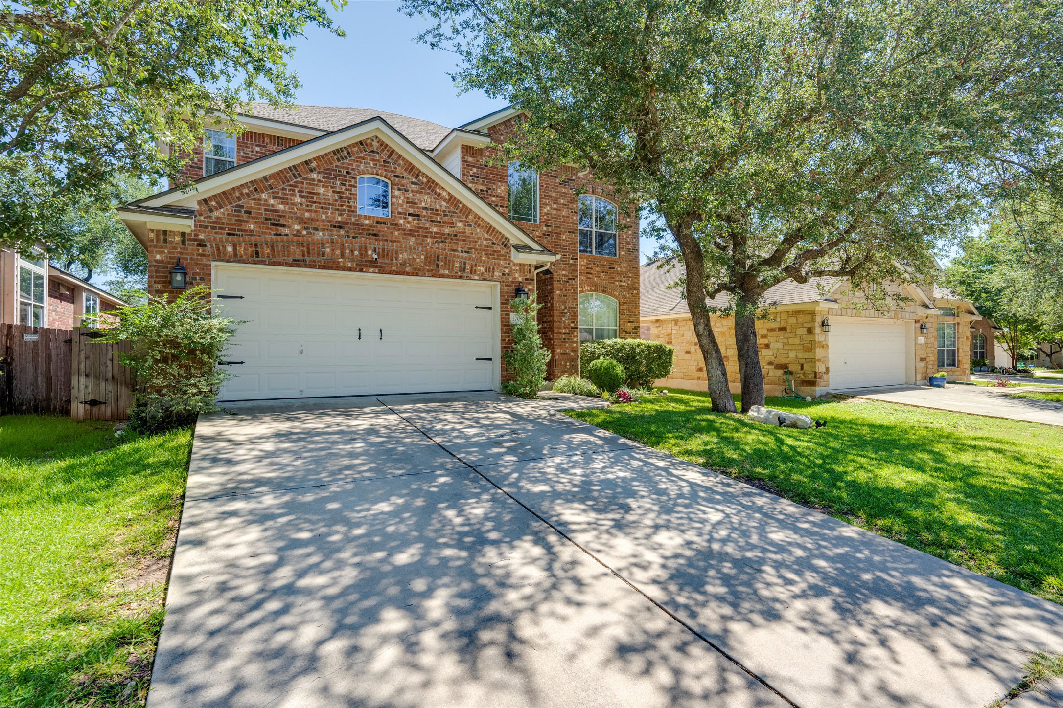 2709 Checker Drive Cedar Park, TX 78613 - Photo 1 of 1 Traditional home featuring driveway, brick siding, a garage, and a shingled roof