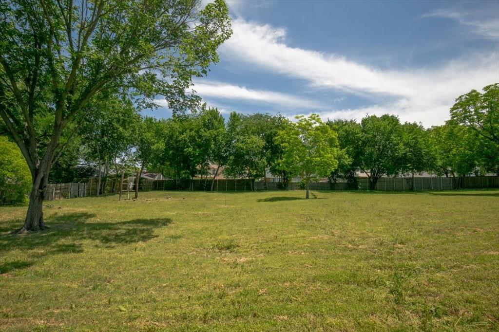 1000 Hughes Road Grapevine, TX 76051 - Photo 8 of 15 a view of a field with trees in the background