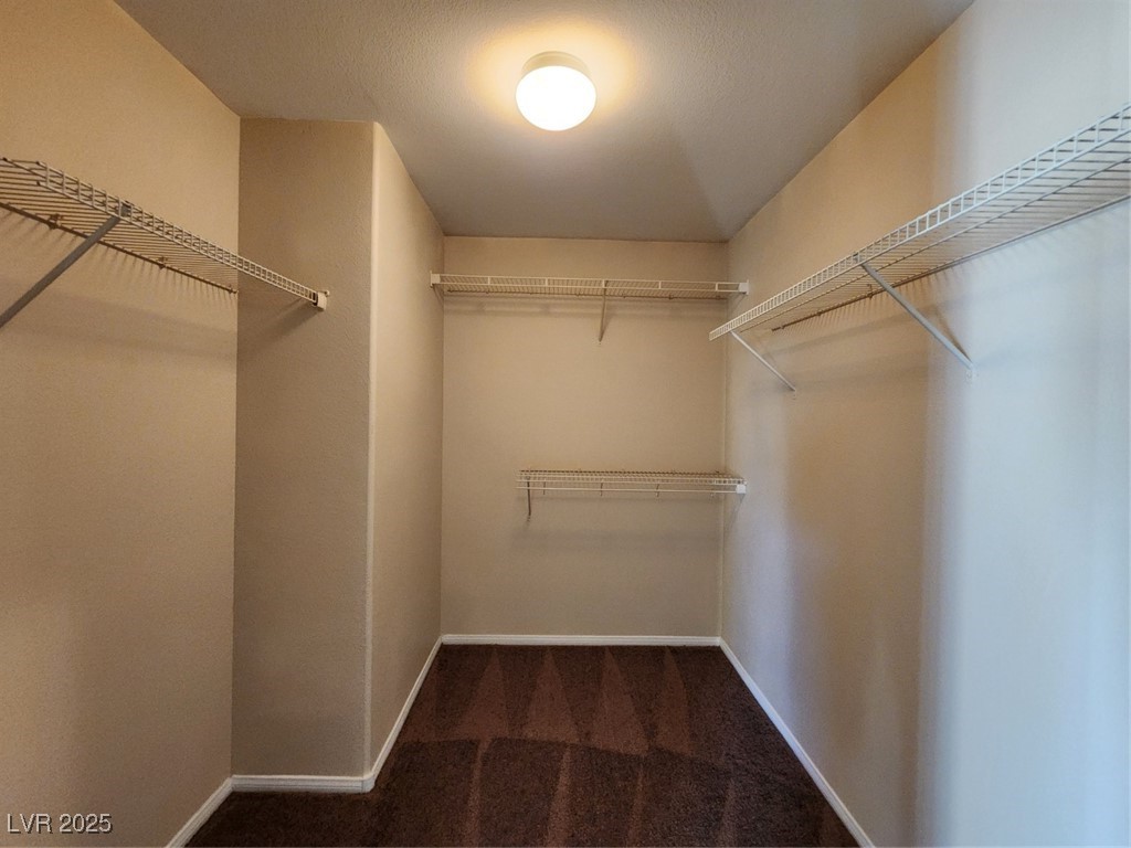 9409 Crimson Sky Street Las Vegas, NV 89178 - Photo 33 of 46 Spacious closet featuring dark colored carpet