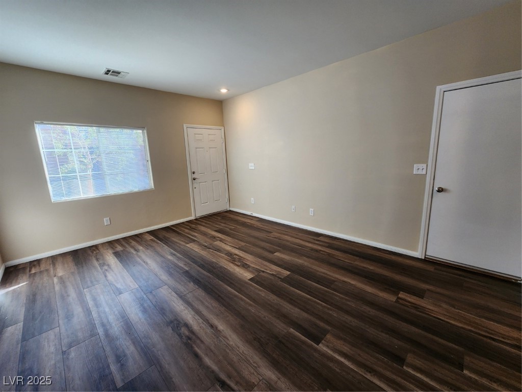 9409 Crimson Sky Street Las Vegas, NV 89178 - Photo 5 of 46 Spare room with dark wood-style flooring and recessed lighting