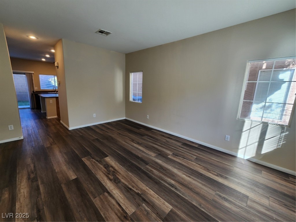 9409 Crimson Sky Street Las Vegas, NV 89178 - Photo 7 of 46 Unfurnished room featuring dark wood-type flooring and recessed lighting