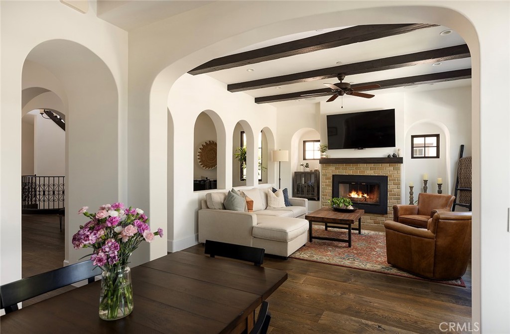 35209 Del Rey Dana Point, CA 92624 - Photo 11 of 44 a living room with furniture a flat screen tv and a fireplace