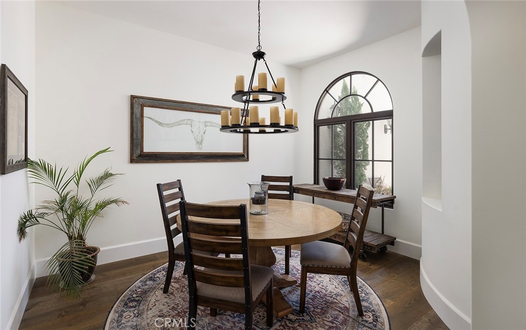 35209 Del Rey Dana Point, CA 92624 - Photo 13 of 44 a dining room with furniture potted plants and wooden floor