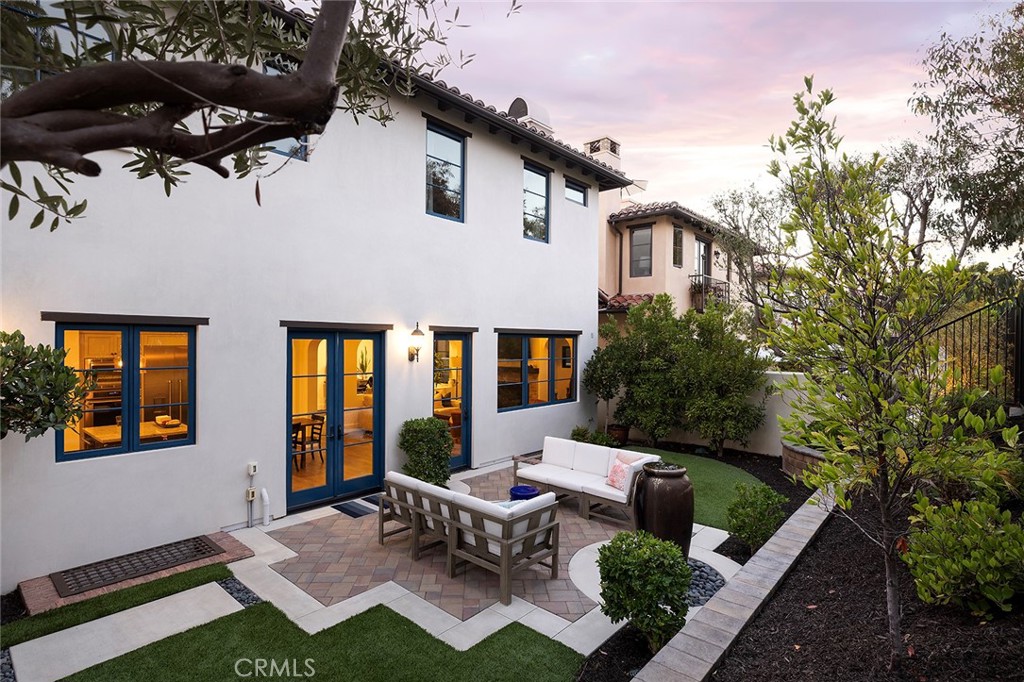 35209 Del Rey Dana Point, CA 92624 - Photo 17 of 44 a view of a patio with couches table and chairs and potted plants