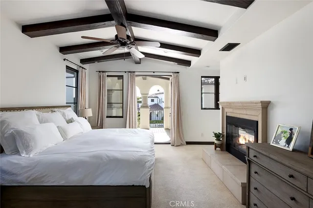 a bedroom with a bed and a fireplace