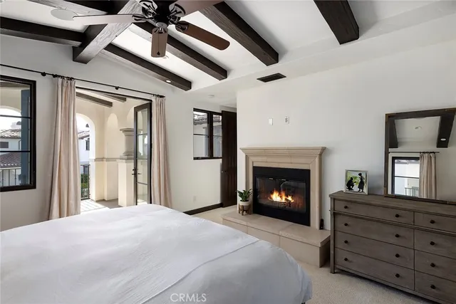a bedroom with a bed and a fireplace