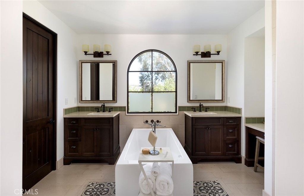 35209 Del Rey Dana Point, CA 92624 - Photo 24 of 44 a bathroom with a sink and a mirror