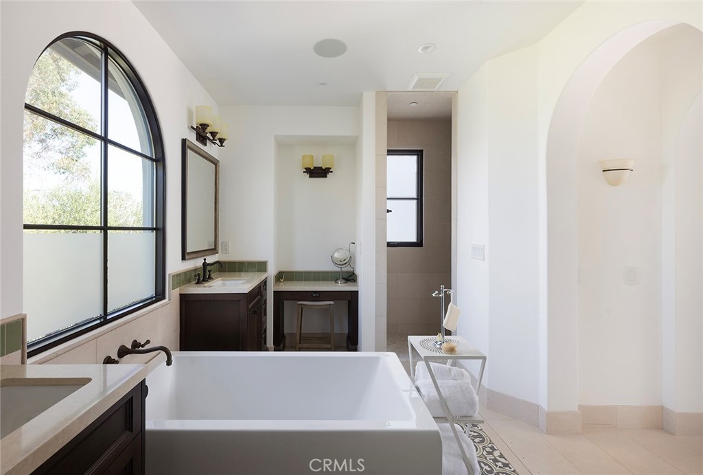 35209 Del Rey Dana Point, CA 92624 - Photo 25 of 44 a bathroom with a tub sink and mirror
