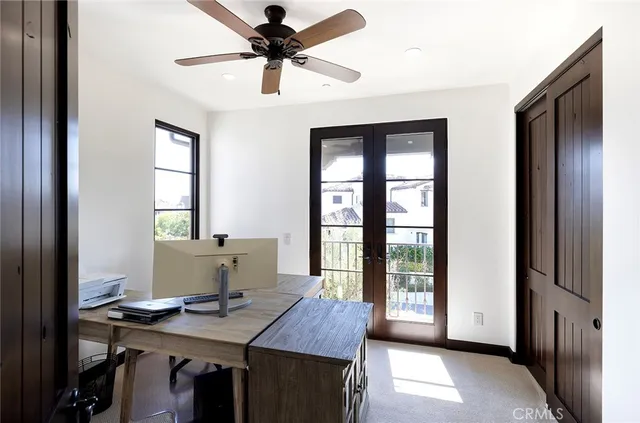 a workspace with furniture and window