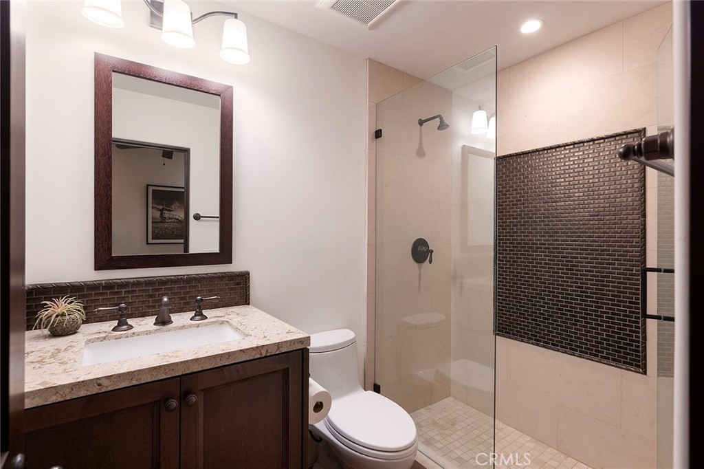35209 Del Rey Dana Point, CA 92624 - Photo 35 of 44 a bathroom with a sink a toilet and shower