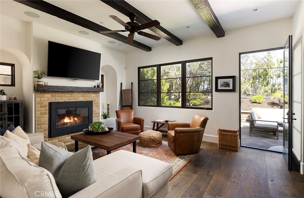 35209 Del Rey Dana Point, CA 92624 - Photo 6 of 44 a living room with furniture a flat screen tv and a fireplace