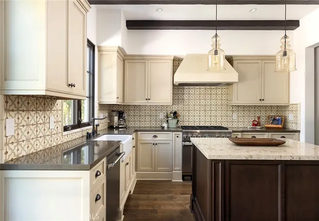 a kitchen with a sink stove top oven and cabinets