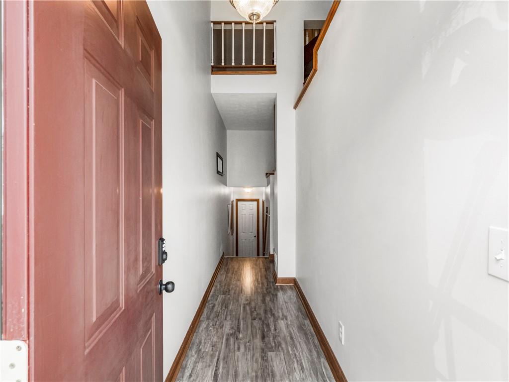 317 Brohios Drive Monaca, PA 15061 - Photo 4 of 27 a view of a hallway with wooden floor and staircase