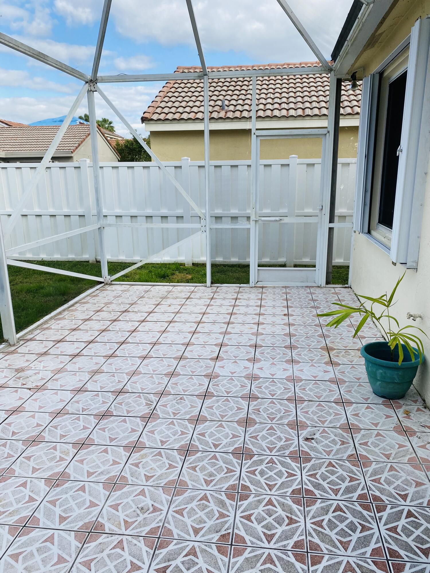 439 Talavera Road Weston, FL 33326 - Photo 16 of 17 a view of a backyard of the house