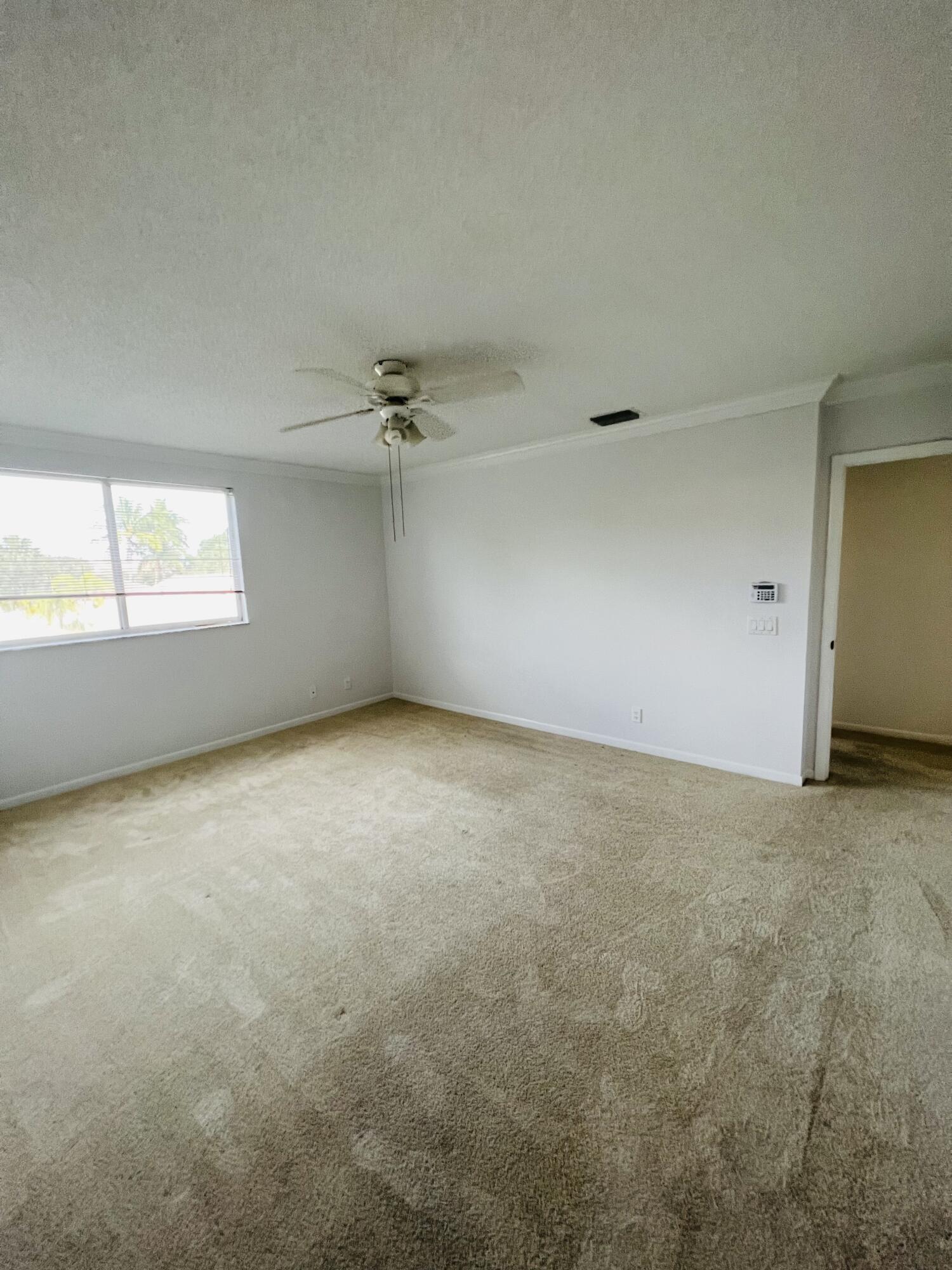 439 Talavera Road Weston, FL 33326 - Photo 10 of 17 an empty room with windows and closet