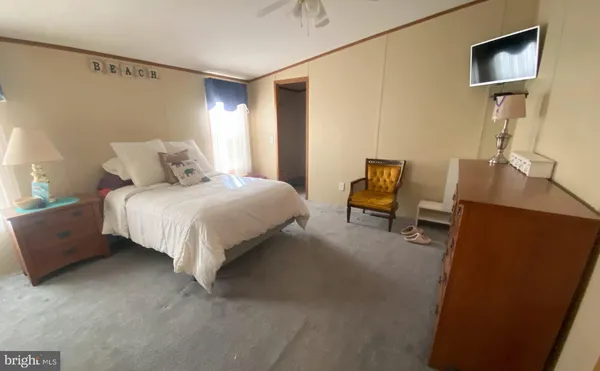 a bed room with a bed and a mirror