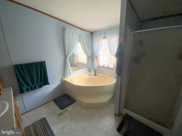 a bedroom with a bed and dresser