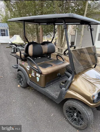 a view of a house with a wooden fence
