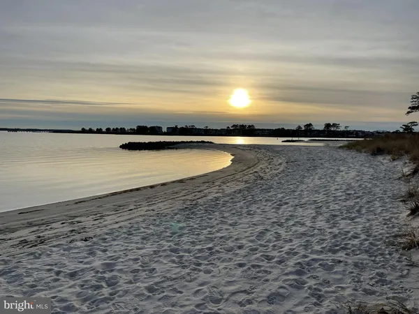 a view of a lake with a house in the background