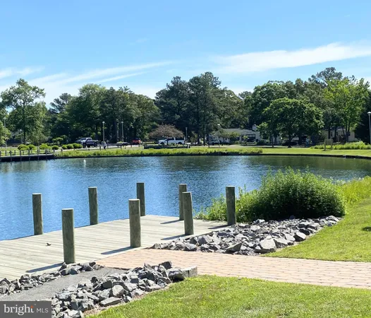 a view of a lake with sitting area