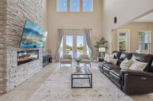 a living room with furniture a dining table and kitchen view