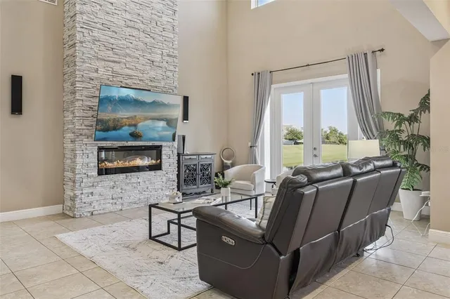 a view of a dining room with furniture and a window