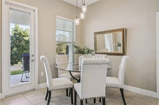 a kitchen with stainless steel appliances kitchen island granite countertop a refrigerator and cabinets
