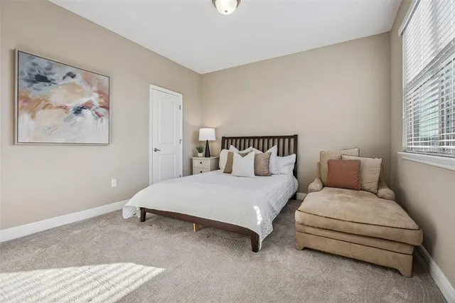 a view of a livingroom with workspace and a window