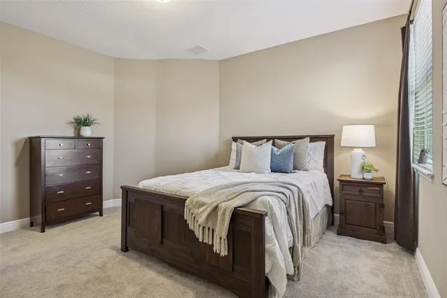 a view of a house with a garden and yard