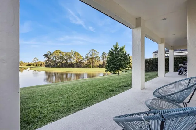 an aerial view of residential houses with outdoor space and swimming pool