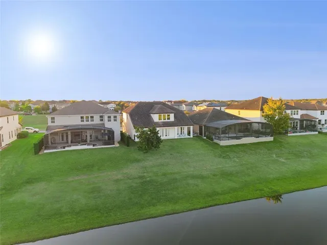 a view of a chair in back yard of a house