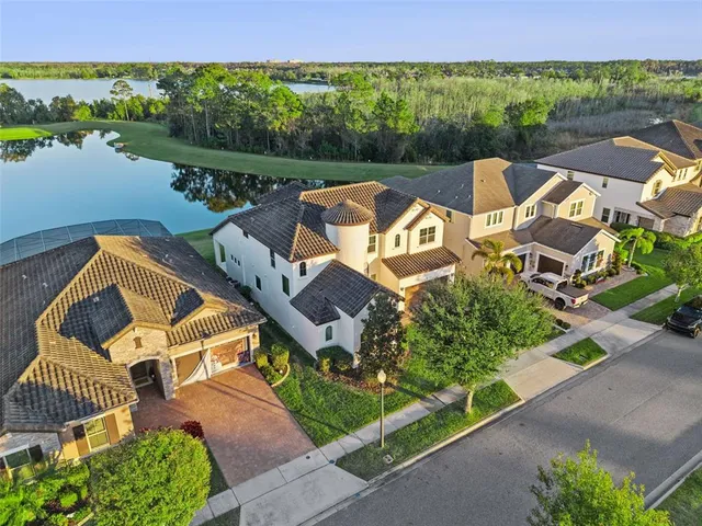 a living room with furniture a couch and kitchen view