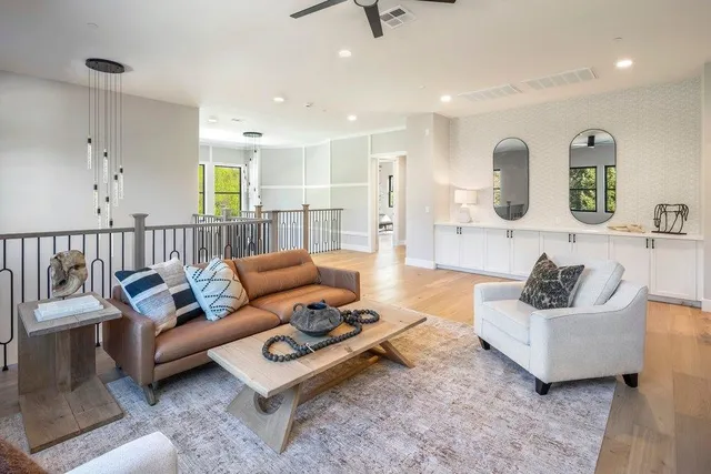 a aerial view of a house with a garden and mountains