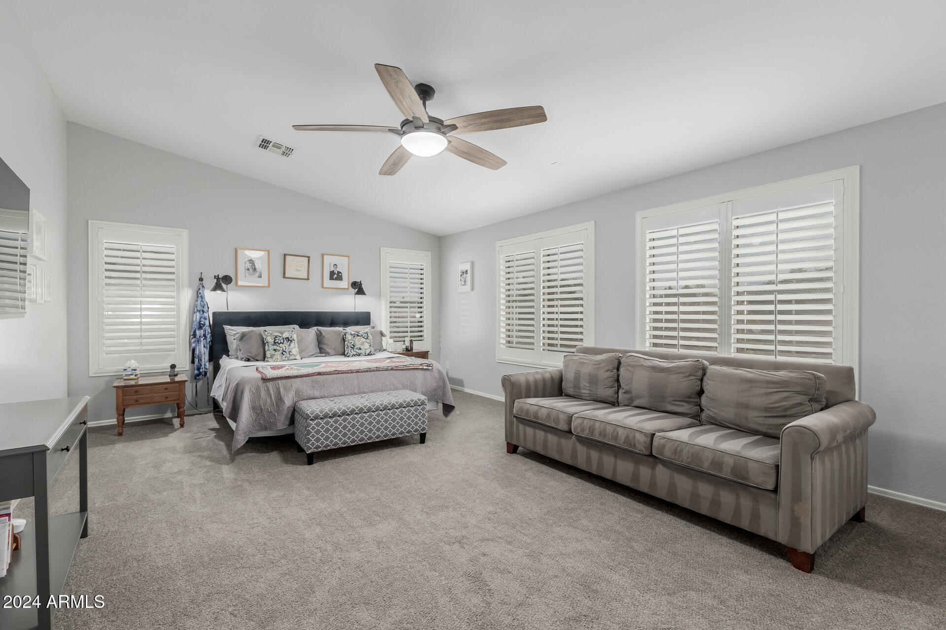 3353 East Blue Ridge Way Gilbert, AZ 85298 - Photo 17 of 50 a bedroom with a bed couch and window