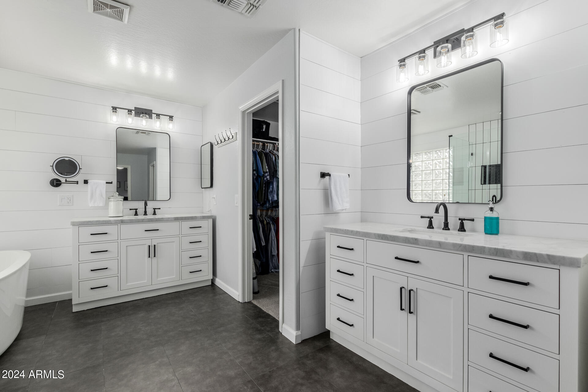 3353 East Blue Ridge Way Gilbert, AZ 85298 - Photo 19 of 50 a spacious bathroom with a double vanity sink and a mirror