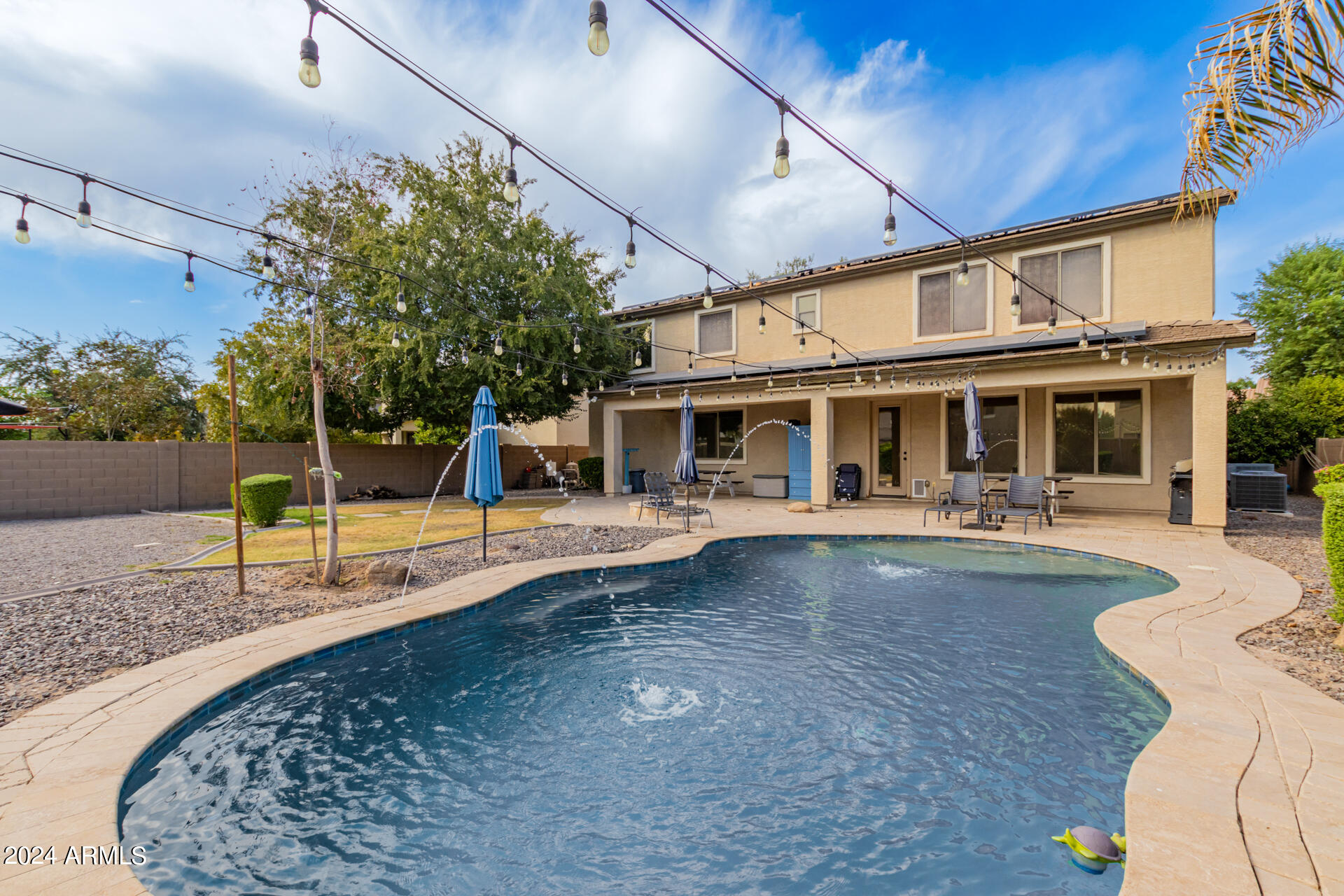 3353 East Blue Ridge Way Gilbert, AZ 85298 - Photo 36 of 50 a view of a house with swimming pool