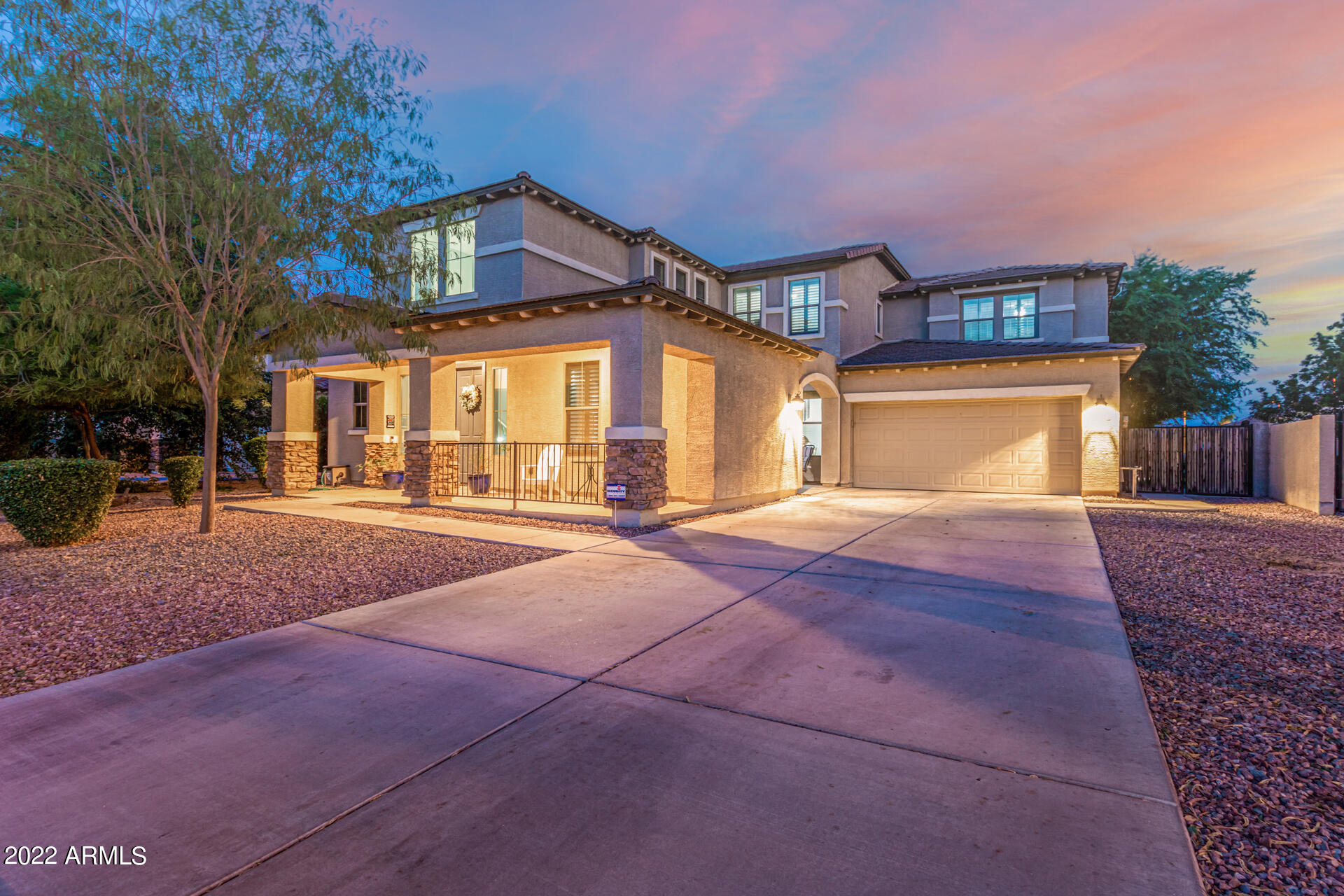 3353 East Blue Ridge Way Gilbert, AZ 85298 - Photo 4 of 50 a front view of a house with a yard and garage