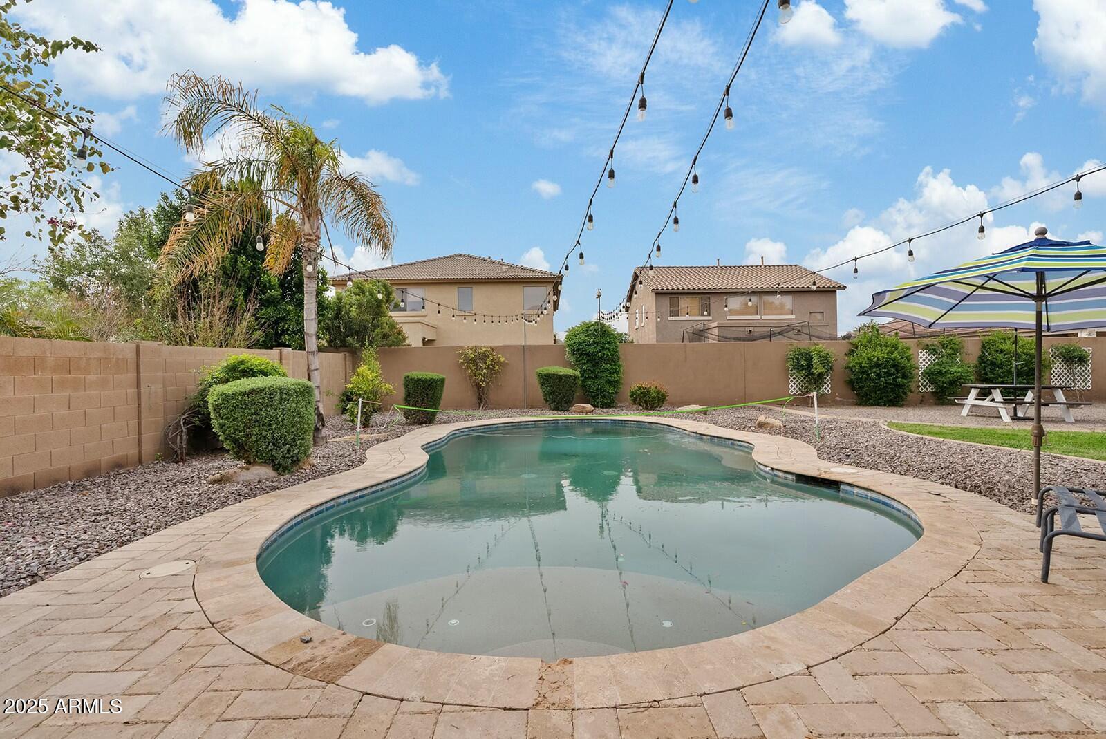 3353 East Blue Ridge Way Gilbert, AZ 85298 - Photo 47 of 50 a view of a swimming pool with a patio