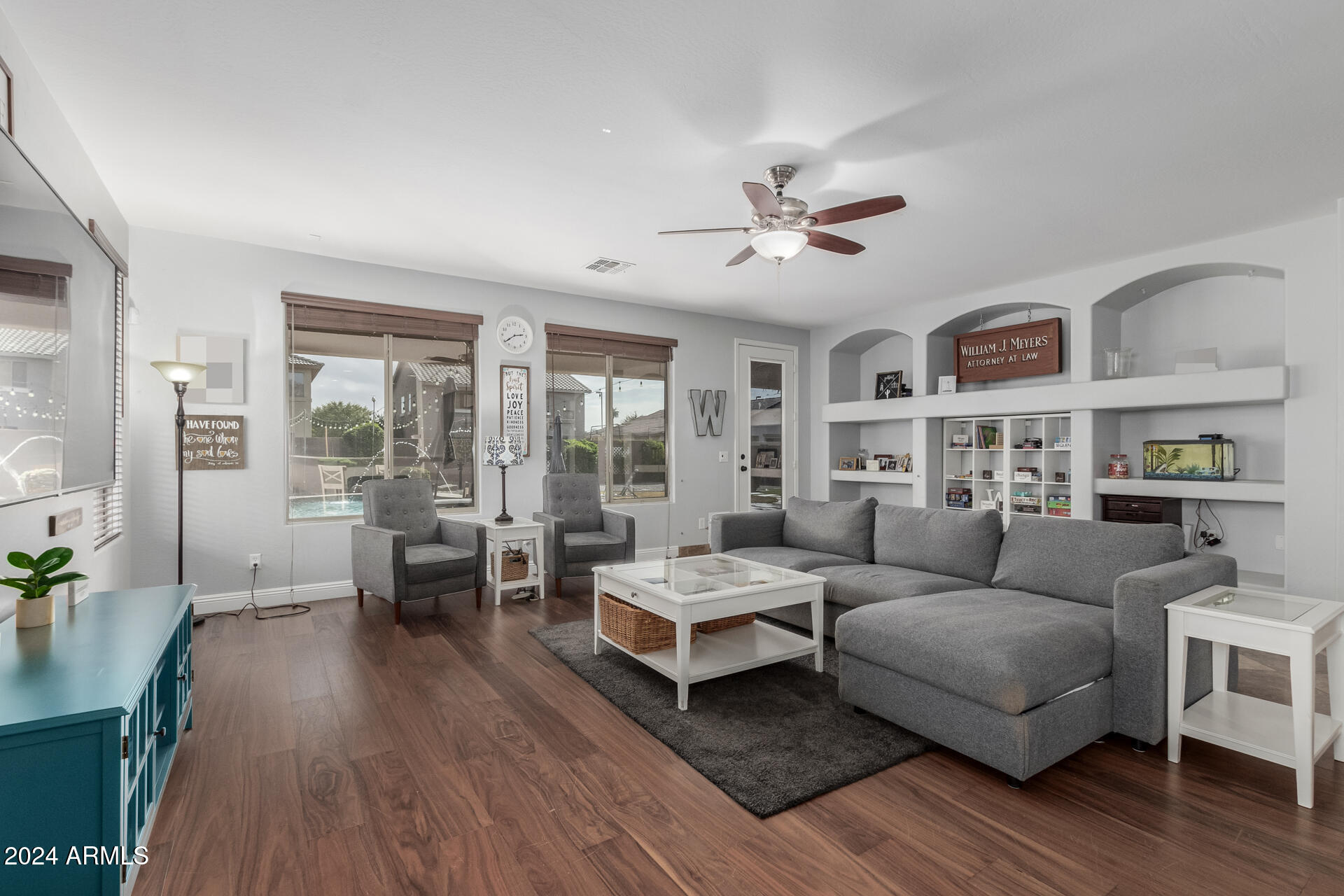 3353 East Blue Ridge Way Gilbert, AZ 85298 - Photo 8 of 50 a living room with furniture and wooden floor