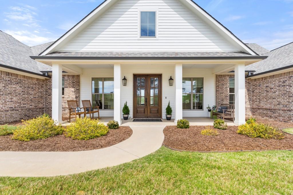 23630 Champion Drive Lindale, TX 75771 - Photo 2 of 36 a view of a house with porch and garden