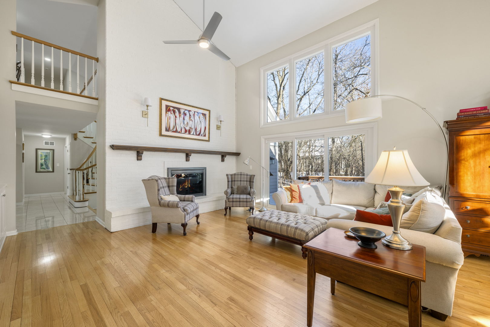 175 Margate Court Lake Bluff, IL 60044 - Photo 7 of 57 a living room with furniture a large window and a flat screen tv