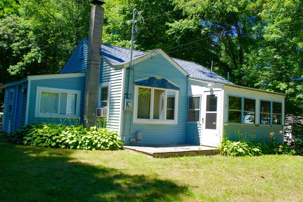 8 Craig Road Holland, MA 01521 - Photo 22 of 24 a front view of a house with a yard