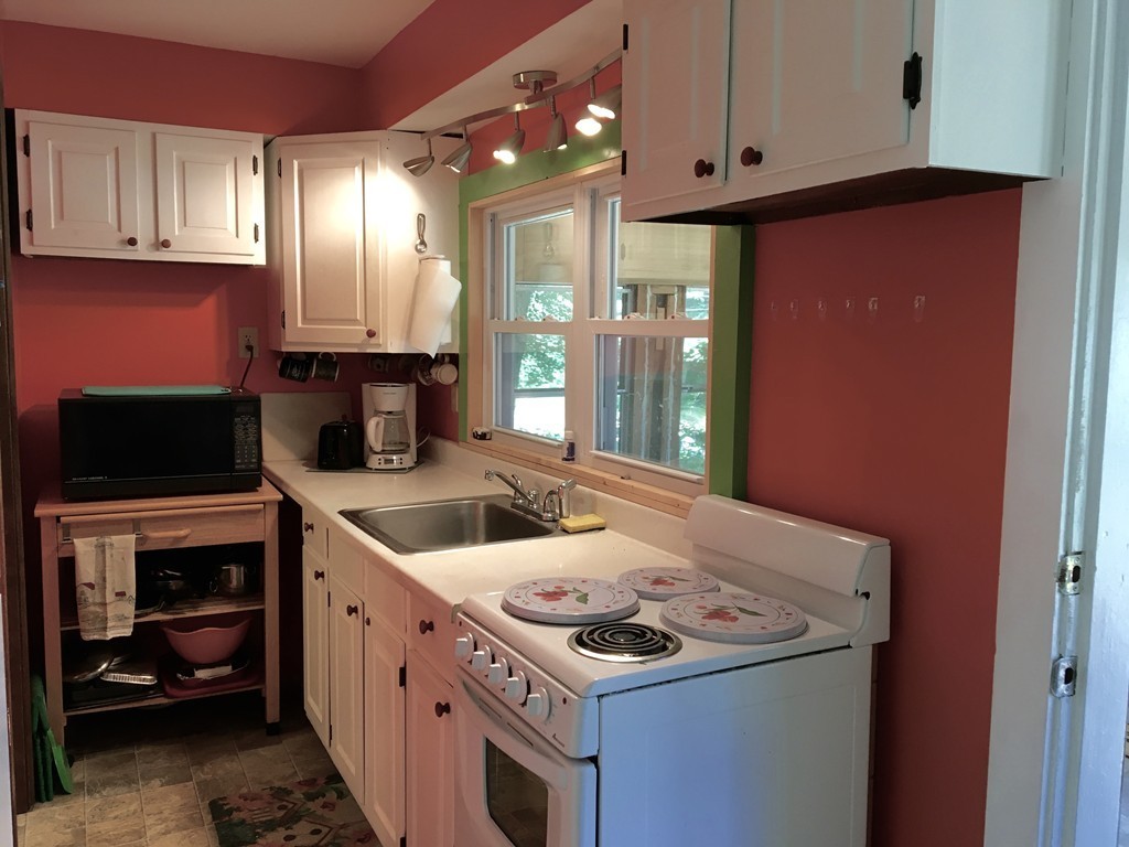 8 Craig Road Holland, MA 01521 - Photo 9 of 24 a kitchen with a stove and a refrigerator