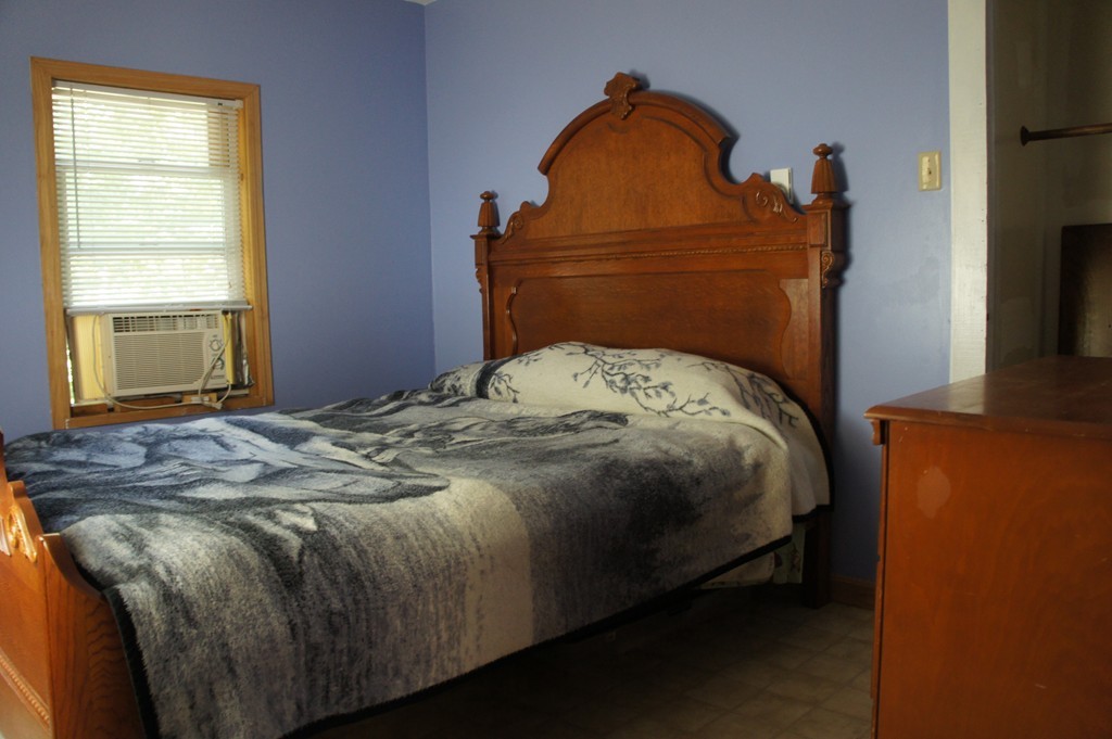 8 Craig Road Holland, MA 01521 - Photo 10 of 24 a bedroom with a bed and window