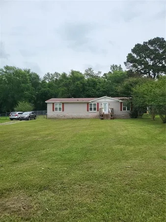 a house view with swimming pool in front of it
