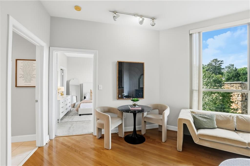 2626 Peachtree Road Northwest, Unit 606 Atlanta, GA 30305 - Photo 11 of 27 a living room with furniture and a large window