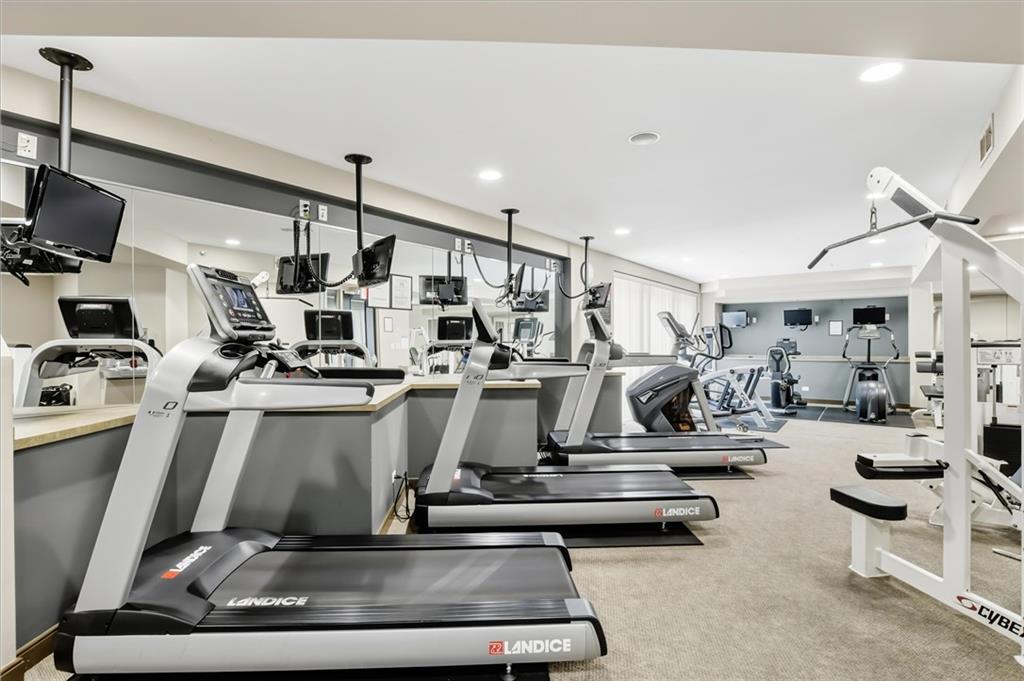 2626 Peachtree Road Northwest, Unit 606 Atlanta, GA 30305 - Photo 26 of 27 a room with gym equipment and a view of living room